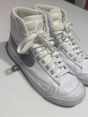 Nike White High-Top Sneakers with Silver Swoosh Accent